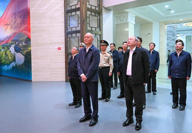 (260922) -- BEIJING, Sept. 22, 2026 (Xinhua) -- Cai Qi, a member of the Standing Committee of the Political Bureau of the Communist Party of China (CPC) Central Committee and a member of the Secretariat of the CPC Central Committee, visits a themed exhibition commemorating the 90th anniversary of the victory of the Long March in Beijing, capital of China, Sept. 22, 2026. The exhibition opened Tuesday at the Military Museum of the Chinese People's Revolution in Beijing. Cai addressed the opening ceremony of the exhibition and declared it open. (Xinhua/Yan Yan)