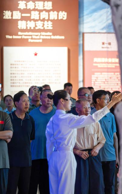 (260922) -- BEIJING, Sept. 22, 2026 (Xinhua) -- People visit a themed exhibition commemorating the 90th anniversary of the victory of the Long March at the Military Museum of the Chinese People's Revolution in Beijing, capital of China, Sept. 22, 2026. The exhibition opened here on Tuesday, taking up approximately 3,300 square meters on the western side of the museum's third floor, with a display route stretching more than 760 meters. (Photo by Zhong Yi/Xinhua)