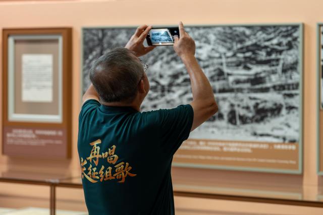 (260922) -- BEIJING, Sept. 22, 2026 (Xinhua) -- A man visits a themed exhibition commemorating the 90th anniversary of the victory of the Long March at the Military Museum of the Chinese People's Revolution in Beijing, capital of China, Sept. 22, 2026. The exhibition opened here on Tuesday, taking up approximately 3,300 square meters on the western side of the museum's third floor, with a display route stretching more than 760 meters. (Photo by Zhong Yi/Xinhua)