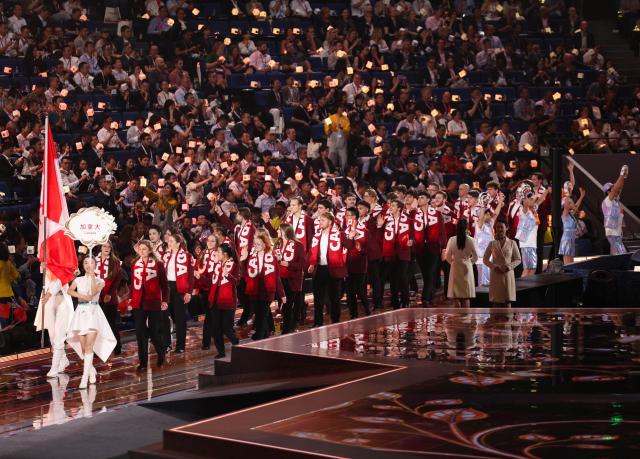 (260922) -- SHANGHAI, Sept. 22, 2026 (Xinhua) -- Members of Canadian delegation attend the opening ceremony of the 48th WorldSkills Competition in east China's Shanghai, Sept. 22, 2026. The 48th WorldSkills Competition opened in Shanghai on Tuesday evening, with 1,385 competitors from 68 countries and regions vying in 64 skill events. (Xinhua/Jin Liwang)
