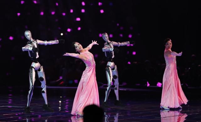 (260922) -- SHANGHAI, Sept. 22, 2026 (Xinhua) -- People and robots perform during the opening ceremony of the 48th WorldSkills Competition in east China's Shanghai, Sept. 22, 2026. The 48th WorldSkills Competition opened in Shanghai on Tuesday evening, with 1,385 competitors from 68 countries and regions vying in 64 skill events. (Xinhua/Fang Zhe)