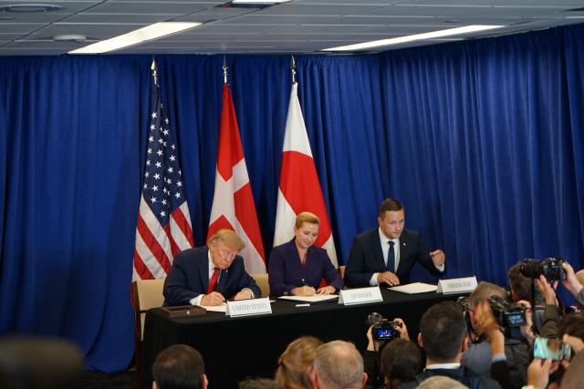 (260922) -- UNITED NATIONS, Sept. 22, 2026 (Xinhua) -- U.S. President Donald Trump, Danish Prime Minister Mette Frederiksen and Greenland's Prime Minister Jens-Frederik Nielsen (from left to right) sign an agreement at a ceremony on the sidelines of the UN General Debate at the United Nations headquarters in New York, Sept. 22, 2026. The United States, Denmark and its autonomous territory of Greenland on Tuesday signed an agreement in New York to expand the U.S. military presence on the strategic Arctic island. (Federica Farina/UN Photo/Handout via Xinhua)