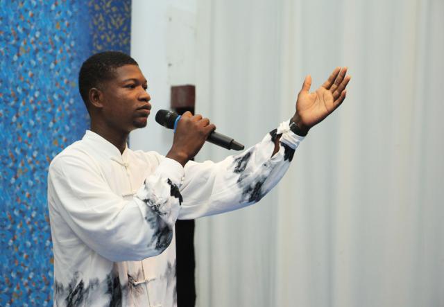 (260923) -- COTONOU, Sept. 23, 2026 (Xinhua) -- A student from the Confucius Institute of the University of Abomey-Calavi recites poems during a poetry event celebrating the Mid-Autumn Festival in Cotonou, Benin, Sept. 22, 2026. The Chinese Cultural Center in Benin and the Confucius Institute of the University of Abomey-Calavi jointly held the event here on Tuesday. (Photo by Seraphin Zounyekpe/Xinhua)
