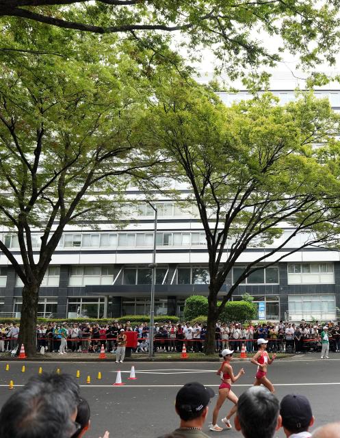 (260923) -- NAGOYA, Sept. 23, 2026 (Xinhua) -- Yang Liujing (R) and Jiang Yunyan of China compete during the Women's Half Marathon Race Walk Final of Athletics at the 20th Asian Games Aichi-Nagoya 2026 in Nagoya, Japan, Sept. 23, 2026. (Xinhua/Jia Yuchen)