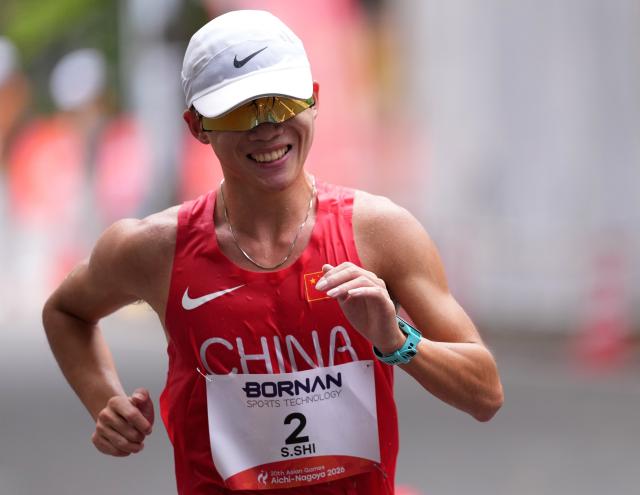 (260923) -- NAGOYA, Sept. 23, 2026 (Xinhua) -- Shi Shengji of China competes during the Men's Half Marathon Race Walk Final of Athletics at the 20th Asian Games Aichi-Nagoya 2026 in Nagoya, Japan, Sept. 23, 2026. (Xinhua/Luo Yuan)