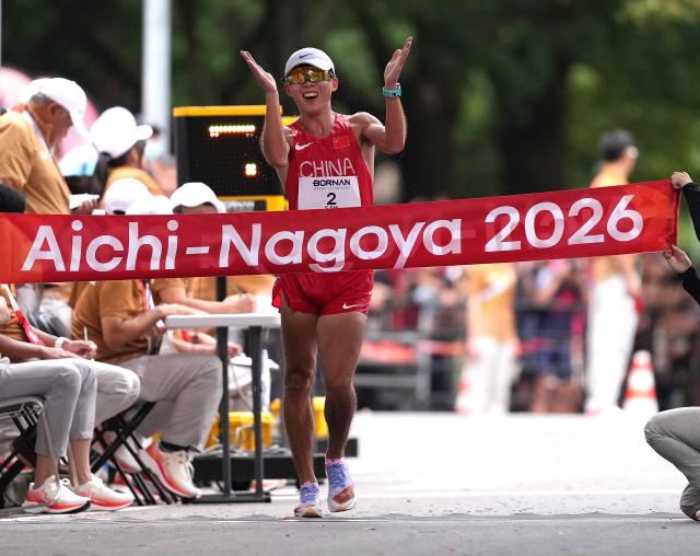 (260923) -- NAGOYA, Sept. 23, 2026 (Xinhua) -- Shi Shengji of China crosses the finish line during the Men's Half Marathon Race Walk Final of Athletics at the 20th Asian Games Aichi-Nagoya 2026 in Nagoya, Japan, Sept. 23, 2026. (Xinhua/Luo Yuan)