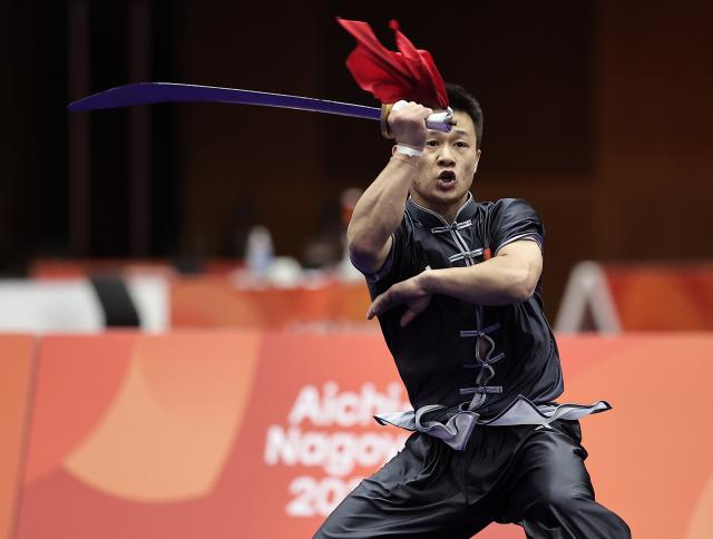 (260923) -- NAGOYA, Sept. 23, 2026 (Xinhua) -- Gao Xiaobin of China competes during the Daoshu round of the Men's Daoshu and Gunshu Final of Wushu at the 20th Asian Games Aichi-Nagoya 2026 in Nagoya, Japan, Sept. 23, 2026. (Xinhua/Long Lei)