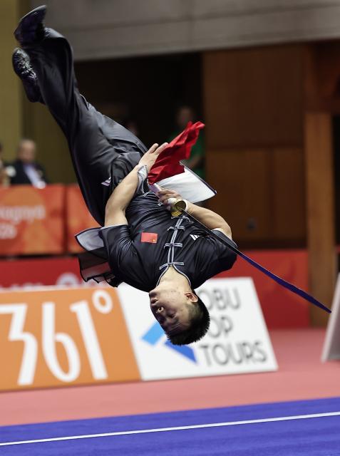 (260923) -- NAGOYA, Sept. 23, 2026 (Xinhua) -- Gao Xiaobin of China competes during the Daoshu round of the Men's Daoshu and Gunshu Final of Wushu at the 20th Asian Games Aichi-Nagoya 2026 in Nagoya, Japan, Sept. 23, 2026. (Xinhua/Long Lei)