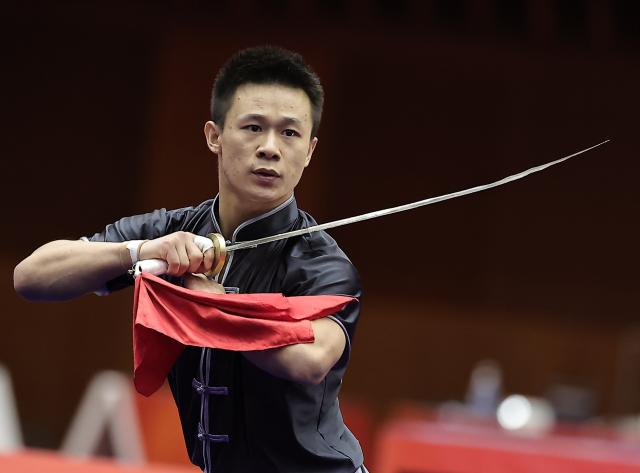 (260923) -- NAGOYA, Sept. 23, 2026 (Xinhua) -- Gao Xiaobin of China competes during the Daoshu round of the Men's Daoshu and Gunshu Final of Wushu at the 20th Asian Games Aichi-Nagoya 2026 in Nagoya, Japan, Sept. 23, 2026. (Xinhua/Long Lei)