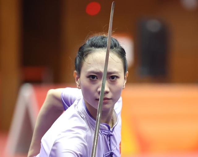 (260923) -- NAGOYA, Sept. 23, 2026 (Xinhua) -- Yao Yang of China competes during the Jianshu round of the Women's Jianshu and Qiangshu of Wushu at the 20th Asian Games Aichi-Nagoya 2026 in Nagoya, Japan, Sept. 23, 2026. (Xinhua/Long Lei)