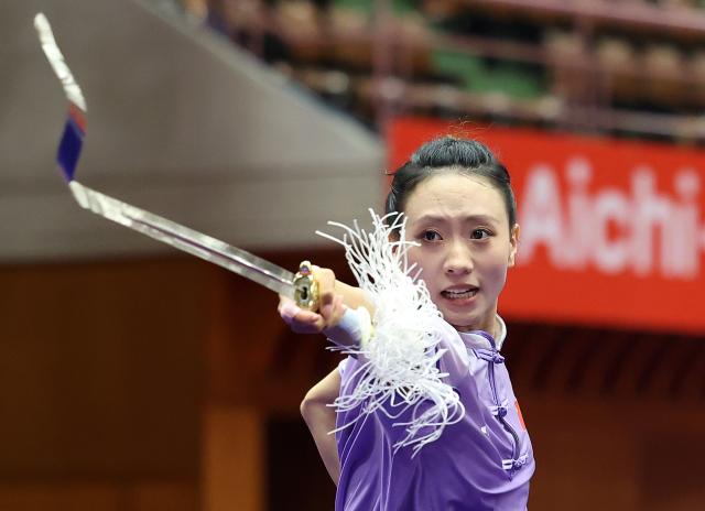 (260923) -- NAGOYA, Sept. 23, 2026 (Xinhua) -- Yao Yang of China competes during the Jianshu round of the Women's Jianshu and Qiangshu Final of Wushu at the 20th Asian Games Aichi-Nagoya 2026 in Nagoya, Japan, Sept. 23, 2026. (Xinhua/Long Lei)