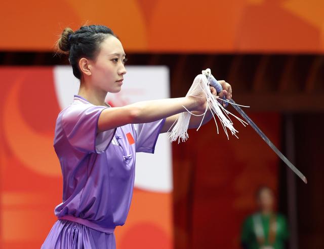 (260923) -- NAGOYA, Sept. 23, 2026 (Xinhua) -- Yao Yang of China competes during the Jianshu round of the Women's Jianshu and Qiangshu Final of Wushu at the 20th Asian Games Aichi-Nagoya 2026 in Nagoya, Japan, Sept. 23, 2026. (Xinhua/Long Lei)