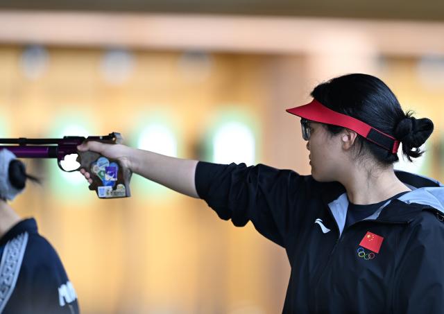 (260923) -- NAGOYA, Sept. 23, 2026 (Xinhua) -- Shen Yiyao of China competes during the 10m air pistol women individual qualification and team final at the 20th Asian Games Aichi-Nagoya 2026 in Toyota of Aichi Prefecture, Japan, Sept. 23, 2026. (Xinhua/Liu Lei)
