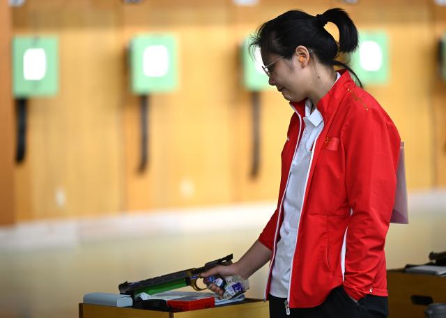 (260923) -- NAGOYA, Sept. 23, 2026 (Xinhua) -- Jiang Ranxin of China reacts during the 10m air pistol women individual qualification and team final at the 20th Asian Games Aichi-Nagoya 2026 in Toyota of Aichi Prefecture, Japan, Sept. 23, 2026. (Xinhua/Liu Lei)