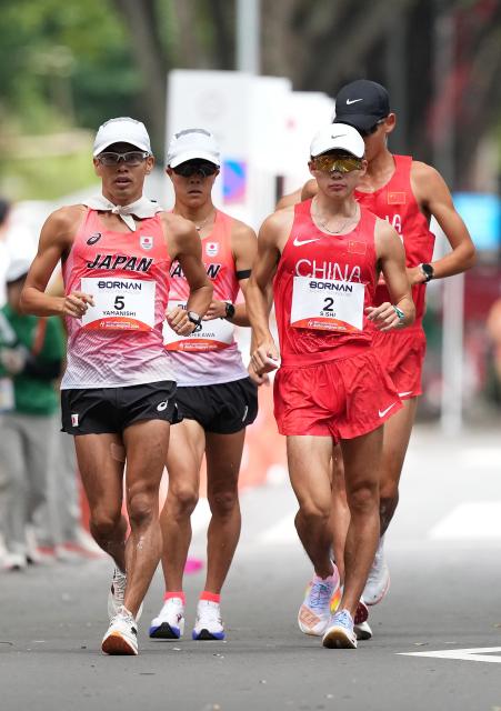 (260923) -- NAGOYA, Sept. 23, 2026 (Xinhua) -- Shi Shengji (2nd R) and Li Chenjie (1st R) of China, Yamanishi Toshikazu (1st L) and Yoshikawa Kento of Japan compete during the Men's Half Marathon Race Walk Final of Athletics at the 20th Asian Games Aichi-Nagoya 2026 in Nagoya, Japan, Sept. 23, 2026. (Xinhua/Jia Yuchen)
