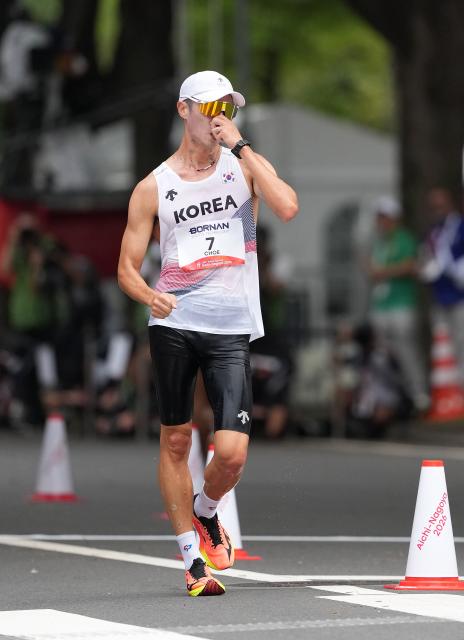 (260923) -- NAGOYA, Sept. 23, 2026 (Xinhua) -- Choe Byeongkwang of South Korea competes during the Men's Half Marathon Race Walk Final of Athletics at the 20th Asian Games Aichi-Nagoya 2026 in Nagoya, Japan, Sept. 23, 2026. (Xinhua/Jia Yuchen)