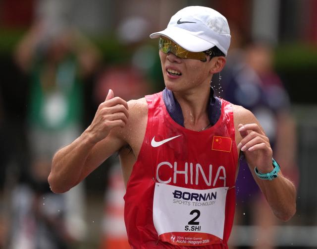 (260923) -- NAGOYA, Sept. 23, 2026 (Xinhua) -- Shi Shengji of China competes during the Men's Half Marathon Race Walk Final of Athletics at the 20th Asian Games Aichi-Nagoya 2026 in Nagoya, Japan, Sept. 23, 2026. (Xinhua/Jia Yuchen)