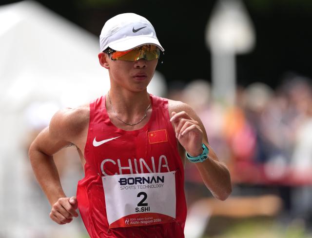 (260923) -- NAGOYA, Sept. 23, 2026 (Xinhua) -- Shi Shengji of China competes during the Men's Half Marathon Race Walk Final of Athletics at the 20th Asian Games Aichi-Nagoya 2026 in Nagoya, Japan, Sept. 23, 2026. (Xinhua/Jia Yuchen)