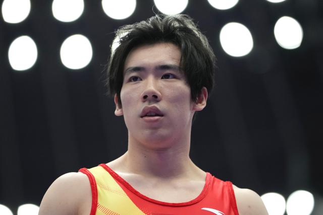 (260923) -- NAGOYA, Sept. 23, 2026 (Xinhua) -- Zhang Boheng of team China prepares for the floor exercise competition of men's team final of Artistic Gymnastics at the 20th Asian Games Aichi-Nagoya 2026 in Nagoya, Japan, Sept. 23, 2026. (Xinhua/Lui Siu Wai)