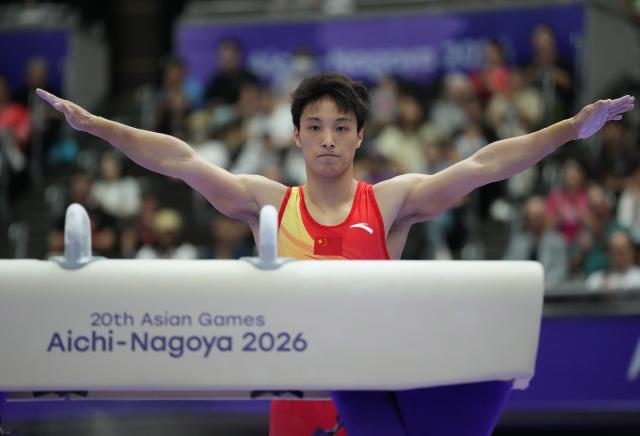(260923) -- NAGOYA, Sept. 23, 2026 (Xinhua) -- Tian Hao of team China reacts after the pommel horse competition of men's team final of Artistic Gymnastics at the 20th Asian Games Aichi-Nagoya 2026 in Nagoya, Japan, Sept. 23, 2026. (Xinhua/Jia Yuchen)