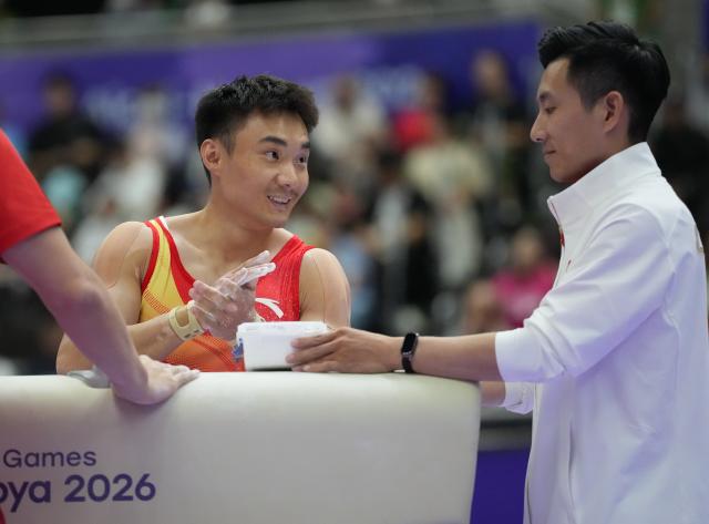 (260923) -- NAGOYA, Sept. 23, 2026 (Xinhua) -- Sun Wei (L) of team China prepares for the pommel horse competition of men's team final of Artistic Gymnastics at the 20th Asian Games Aichi-Nagoya 2026 in Nagoya, Japan, Sept. 23, 2026. (Xinhua/Jia Yuchen)