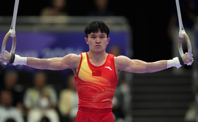 (260923) -- NAGOYA, Sept. 23, 2026 (Xinhua) -- Lan Xingyu of team China competes during the rings competition of men's team final of Artistic Gymnastics at the 20th Asian Games Aichi-Nagoya 2026 in Nagoya, Japan, Sept. 23, 2026. (Xinhua/Lui Siu Wai)