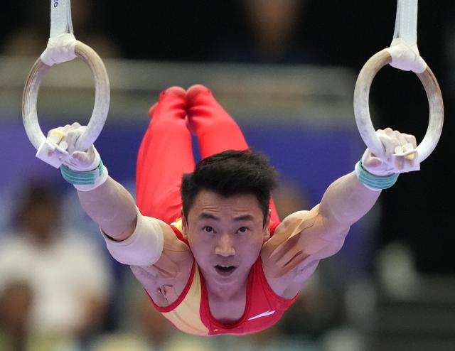 (260923) -- NAGOYA, Sept. 23, 2026 (Xinhua) -- Zou Jingyuan of team China competes during the rings competition of men's team final of Artistic Gymnastics at the 20th Asian Games Aichi-Nagoya 2026 in Nagoya, Japan, Sept. 23, 2026. (Xinhua/Lui Siu Wai)