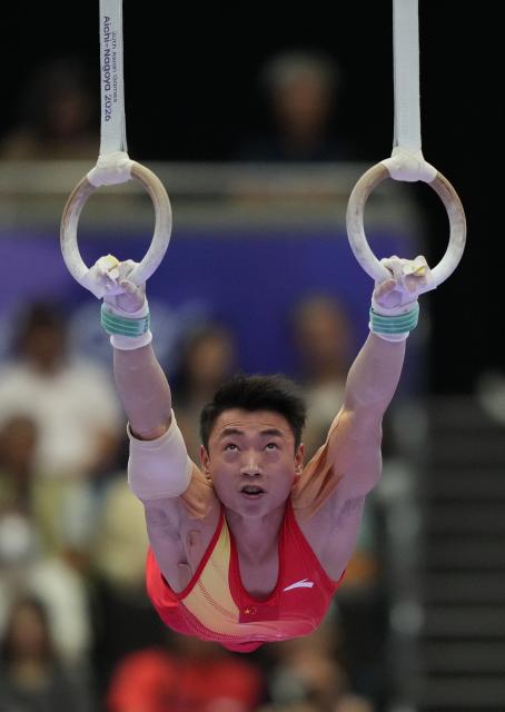 (260923) -- NAGOYA, Sept. 23, 2026 (Xinhua) -- Zou Jingyuan of team China competes during the rings competition of men's team final of Artistic Gymnastics at the 20th Asian Games Aichi-Nagoya 2026 in Nagoya, Japan, Sept. 23, 2026. (Xinhua/Lui Siu Wai)