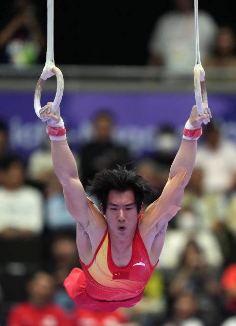 (260923) -- NAGOYA, Sept. 23, 2026 (Xinhua) -- Zhang Boheng of team China competes during the rings competition of men's team final of Artistic Gymnastics at the 20th Asian Games Aichi-Nagoya 2026 in Nagoya, Japan, Sept. 23, 2026. (Xinhua/Lui Siu Wai)