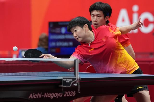 (260923) -- TOYOTA, Sept. 23, 2026 (Xinhua) -- Wang Chuqin/Sun Yingsha (L) compete during the mixed doubles round 3 match between Wang Chuqin/Sun Yingsha (China) and Feng Yi-hsin/Yeh Yi-tian (Chinese Taipei) at the 20th Asian Games Aichi-Nagoya 2026 in Toyota, Japan, Sept. 23, 2026. (Xinhua/Cheong Kam Ka)