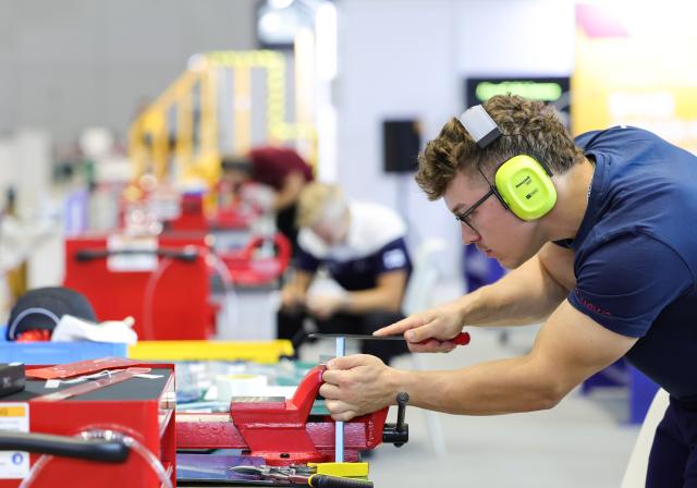 (260923) -- SHANGHAI, Sept. 23, 2026 (Xinhua) -- A contestant participates in the aircraft maintenance event during the 48th WorldSkills Competition in east China's Shanghai, Sept. 23, 2026. The competition kicks off at the National Exhibition and Convention Center here on Wednesday. (Xinhua/Wang Jingqiang)