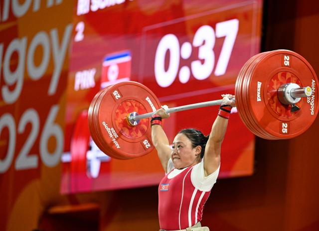 (260923) -- NAGOYA, Sept. 23, 2026 (Xinhua) -- Ri Song Gum of the Democratic People's Republic of Korea competes during the women's 49kg final of weightlifting at the 20th Asian Games Aichi-Nagoya 2026 in Nagoya, Japan, Sept. 23, 2026. (Xinhua/Yu Yang)