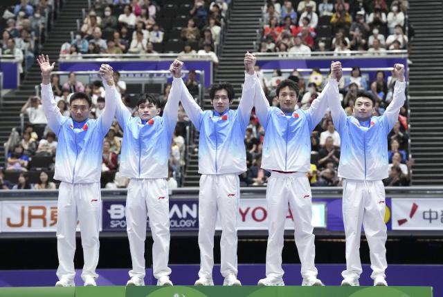 (260923) -- NAGOYA, Sept. 23, 2026 (Xinhua) -- Gold medalists Sun Wei, Lan Xingyu, Zhang Boheng, Tian Hao and Zou Jingyuan (from L to R) of team China pose during the awarding ceremony for men's team of Artistic Gymnastics at the 20th Asian Games Aichi-Nagoya 2026 in Nagoya, Japan, Sept. 23, 2026. (Xinhua/Jia Yuchen)