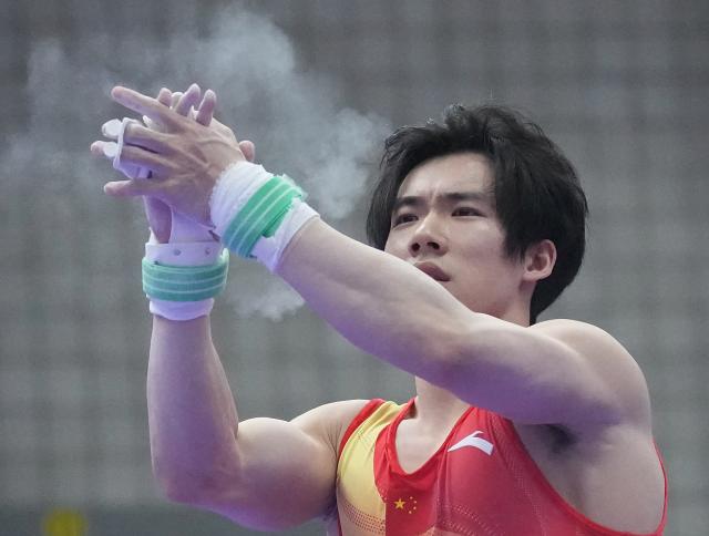 (260923) -- NAGOYA, Sept. 23, 2026 (Xinhua) -- Zhang Boheng of team China reacts after during the horizontal bar competition of men's team final of Artistic Gymnastics at the 20th Asian Games Aichi-Nagoya 2026 in Nagoya, Japan, Sept. 23, 2026. (Xinhua/Jia Yuchen)