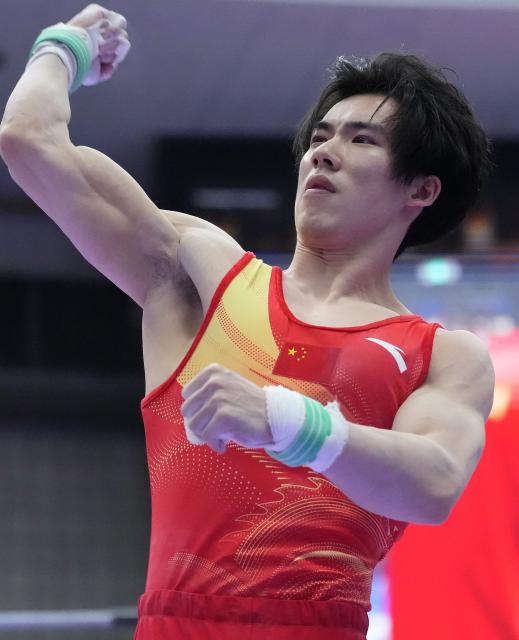 (260923) -- NAGOYA, Sept. 23, 2026 (Xinhua) -- Zhang Boheng of team China reacts after the horizontal bar competition of men's team final of Artistic Gymnastics at the 20th Asian Games Aichi-Nagoya 2026 in Nagoya, Japan, Sept. 23, 2026. (Xinhua/Jia Yuchen)