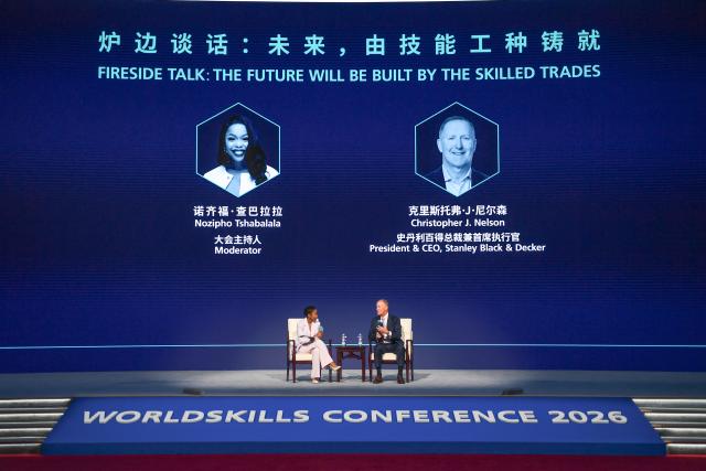 (260923) -- SHANGHAI, Sept. 23, 2026 (Xinhua) -- This photo taken on Sept. 23, 2026 shows a scene of the "fireside talk: the future will be built by the skilled trades" during the WorldSkills Conference 2026 in east China's Shanghai. The WorldSkills Conference 2026 kicked off here on Wednesday. (Photo by Yang Yang/Xinhua)