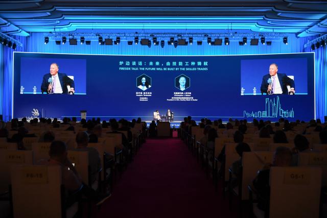 (260923) -- SHANGHAI, Sept. 23, 2026 (Xinhua) -- This photo taken on Sept. 23, 2026 shows a scene of the "fireside talk: the future will be built by the skilled trades" during the WorldSkills Conference 2026 in east China's Shanghai. The WorldSkills Conference 2026 kicked off here on Wednesday. (Photo by Yang Yang/Xinhua)