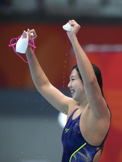 (260923) -- TOKYO, Sept. 23, 2026 (Xinhua) -- Tang Qianting of China celebrates after the women's 100m breaststroke final at the 20th Asian Games Aichi-Nagoya 2026 in Tokyo, Japan, Sept. 23, 2026. (Xinhua/Chen Zeguo)