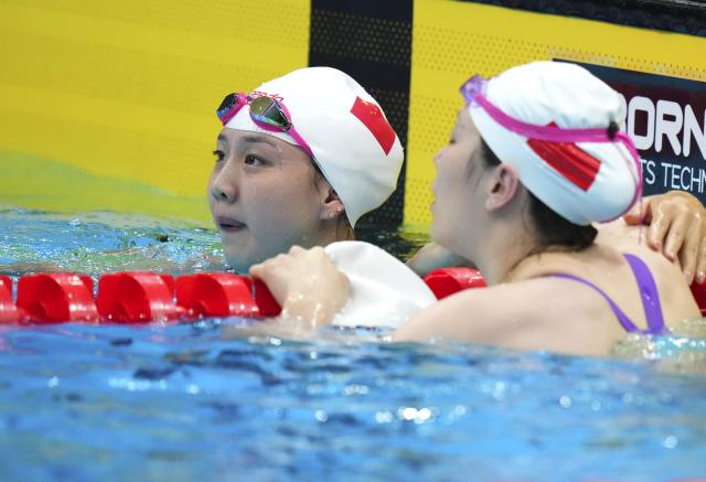 (260923) -- TOKYO, Sept. 23, 2026 (Xinhua) -- Tang Qianting (L) of China looks on after the women's 100m breaststroke final at the 20th Asian Games Aichi-Nagoya 2026 in Tokyo, Japan, Sept. 23, 2026. (Xinhua/Chen Zeguo)