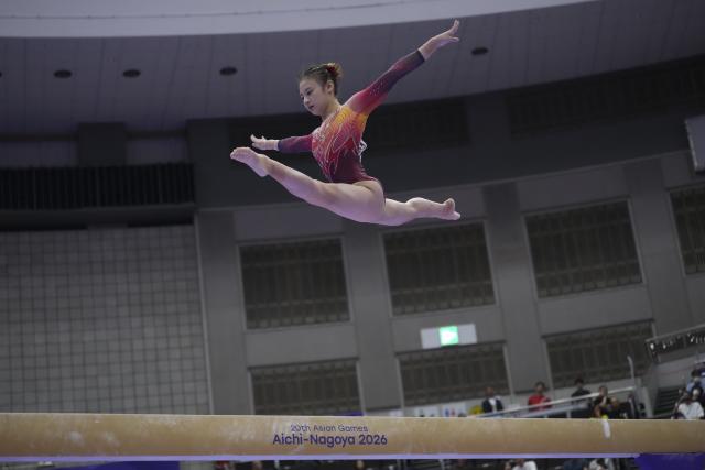 (260923) -- NAGOYA, Sept. 23, 2026 (Xinhua) -- Qiu Qiyuan of China competes during the balance beam competition of the women's team final of Artistic Gymnastics at the 20th Asian Games Aichi-Nagoya 2026 in Nagoya, Japan, Sept. 23, 2026. (Xinhua/Jia Yuchen)