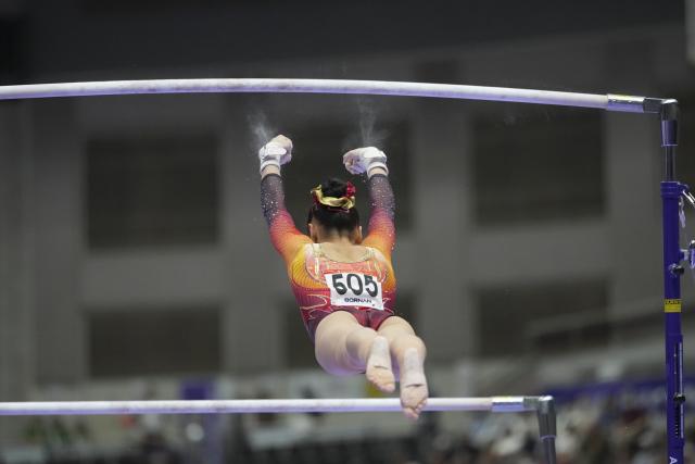(260923) -- NAGOYA, Sept. 23, 2026 (Xinhua) -- Qiu Qiyuan of China competes during the uneven bars competition of the women's team final of Artistic Gymnastics at the 20th Asian Games Aichi-Nagoya 2026 in Nagoya, Japan, Sept. 23, 2026. (Xinhua/Lui Siu Wai)