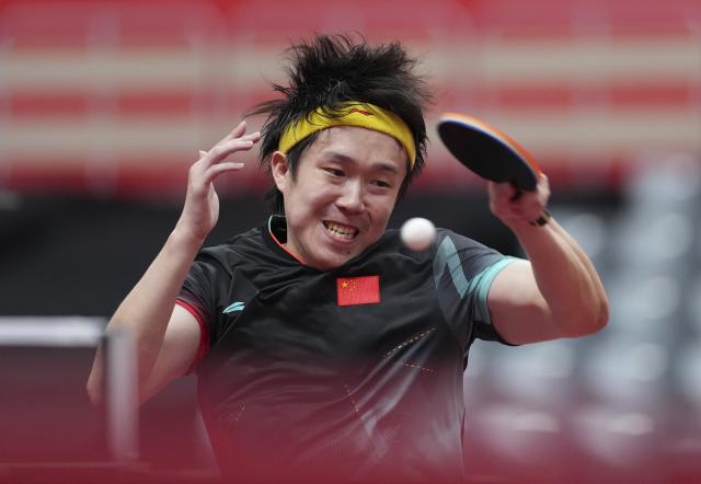 (260923) -- TOYOTA, Sept. 23, 2026 (Xinhua) -- Wang Chuqin of China hits a return against Lin Yun-ju of Chinese Taipei during the men's team semifinal match between China and Chinese Taipei at the 20th Asian Games Aichi-Nagoya 2026 in Toyota of Aichi Prefecture, Japan, Sept. 23, 2026. (Xinhua/Cheong Kam Ka)