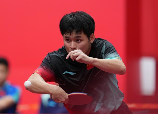 (260923) -- TOYOTA, Sept. 23, 2026 (Xinhua) -- Lin Shidong of China hits a return against Feng Yi-hsin of Chinese Taipei during the men's team semifinal match between China and Chinese Taipei at the 20th Asian Games Aichi-Nagoya 2026 in Toyota of Aichi Prefecture, Japan, Sept. 23, 2026. (Xinhua/Cheong Kam Ka)