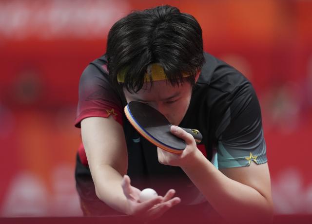 (260923) -- TOYOTA, Sept. 23, 2026 (Xinhua) -- Wang Chuqin of China serves against Lin Yun-ju of Chinese Taipei during the men's team semifinal match between China and Chinese Taipei at the 20th Asian Games Aichi-Nagoya 2026 in Toyota of Aichi Prefecture, Japan, Sept. 23, 2026. (Xinhua/Cheong Kam Ka)