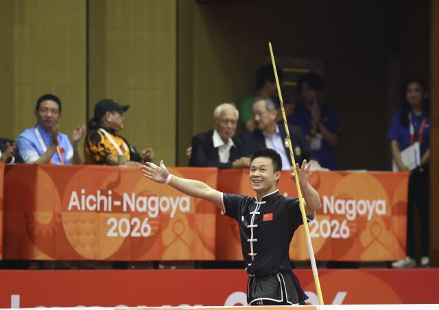 (260923) -- NAGOYA, Sept. 23, 2026 (Xinhua) -- Gao Xiaobin of China reacts during the Gunshu round of the Men's Daoshu and Gunshu Final of Wushu at the 20th Asian Games Aichi-Nagoya 2026 in Nagoya, Japan, Sept. 23, 2026. (Xinhua/Long Lei)