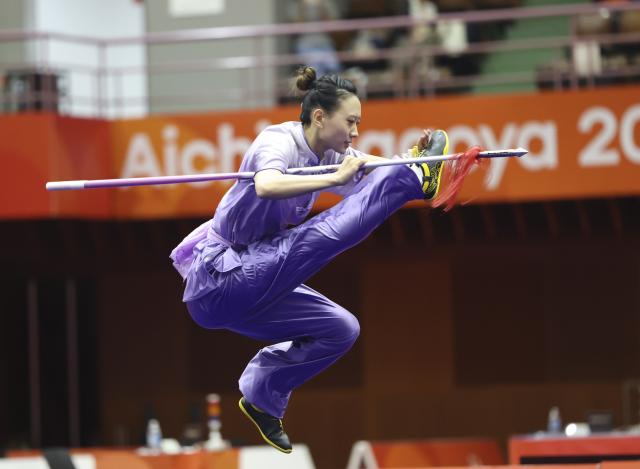 (260923) -- NAGOYA, Sept. 23, 2026 (Xinhua) -- Yao Yang of China competes during the Qiangshu round of the Women's Jianshu and Qiangshu Final of Wushu at the 20th Asian Games Aichi-Nagoya 2026 in Nagoya, Japan, Sept. 23, 2026. (Xinhua/Long Lei)