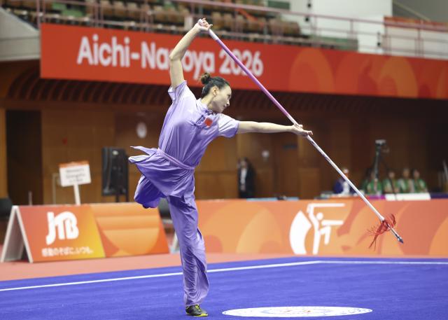 (260923) -- NAGOYA, Sept. 23, 2026 (Xinhua) -- Yao Yang of China competes during the Qiangshu round of the Women's Jianshu and Qiangshu Final of Wushu at the 20th Asian Games Aichi-Nagoya 2026 in Nagoya, Japan, Sept. 23, 2026. (Xinhua/Long Lei)