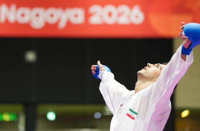 (260923) -- TOYOHASHI, Sept. 23, 2026 (Xinhua) -- Mahmoud Nemati of Iran celebrates after defeating Sanad Hassan Y Sufyani of Saudi Arabia in the men's kumite +84kg final of Karate at the 20th Asian Games Aichi-Nagoya 2026 in Toyohashi of Aichi Prefecture, Japan, Sept. 23, 2026. (Xinhua/Wang Fei)