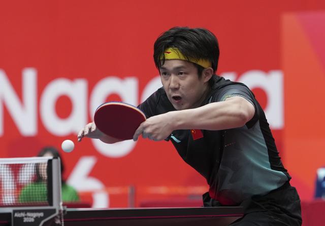 (260923) -- TOYOTA, Sept. 23, 2026 (Xinhua) -- Wang Chuqin of China hits a return against Lin Yun-ju of Chinese Taipei during the men's team semifinal match between China and Chinese Taipei at the 20th Asian Games Aichi-Nagoya 2026 in Toyota of Aichi Prefecture, Japan, Sept. 23, 2026. (Xinhua/Cheong Kam Ka)