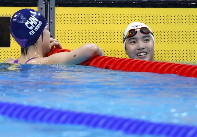 (260923) -- TOKYO, Sept. 23, 2026 (Xinhua) -- Yu Zidi (R) and Ke Wenxi of China react after the women's 400m individual medley final at the 20th Asian Games Aichi-Nagoya 2026 in Tokyo, Japan, Sept. 23, 2026. (Xinhua/Wu Zhizun)